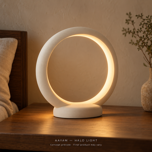 AAYAM Halo Light concept preview: a matte ivory open circular ring with warm inner illumination. Final product may vary.